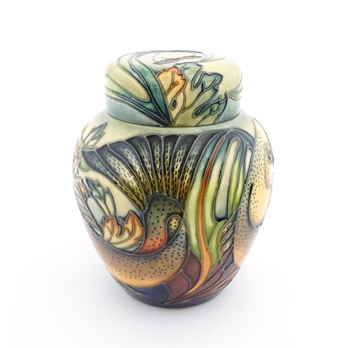 144 - A Moorcroft ginger jar decorated in the Trout pattern with fish detail. Marked under with makers mar... 