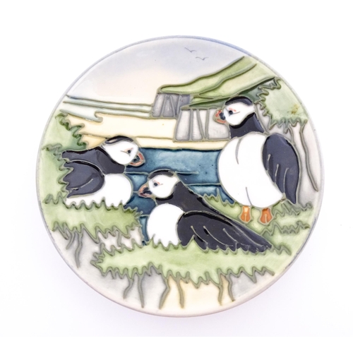 146 - A Moorcroft pin dish decorated in the Puffins pattern. Approx. 4 1/2