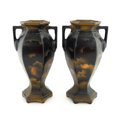 154 - A pair of twin handled vases of hexagonal form with Japanese Geisha decoration. Approx. 12