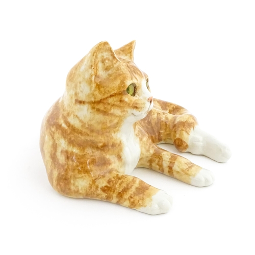 156 - A large Winstanley model of a recumbent ginger cat, size 7. Marked under. Approx. 13 1/2