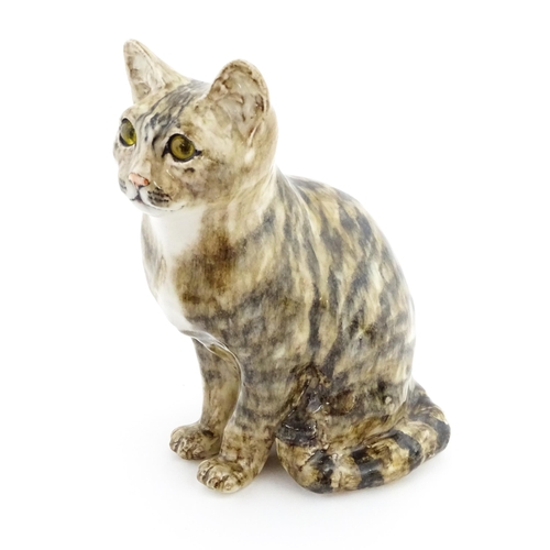 157 - A large Winstanley model of a seated tabby cat, size 6. Marked under. Approx. 11 1/4