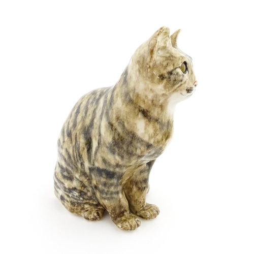 157 - A large Winstanley model of a seated tabby cat, size 6. Marked under. Approx. 11 1/4