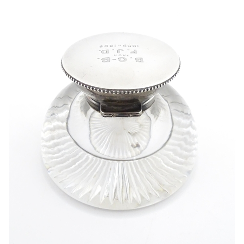 209 - A glass inkwell with silver top hallmarked London 1905 maker James Dudley and stamped J Dudley South... 