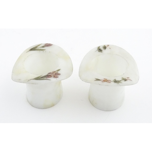 216 - A pair of milk glass match holders / vesta keeps  formed as top hats with hand painted floral detail... 