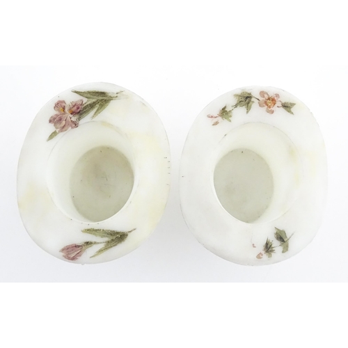 216 - A pair of milk glass match holders / vesta keeps  formed as top hats with hand painted floral detail... 