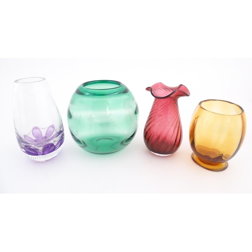 232 - Four assorted glass vases to include examples by Dartington, etc. Largest approx. 7 3/4