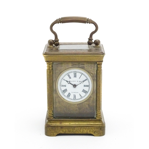 1436 - A small brass carriage clock with white enamel dial with Roman Numerals and signed ' Elliot & Son Lo... 