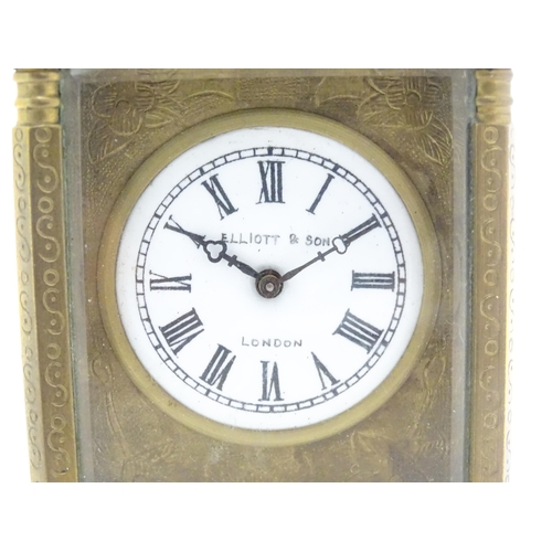 1436 - A small brass carriage clock with white enamel dial with Roman Numerals and signed ' Elliot & Son Lo... 