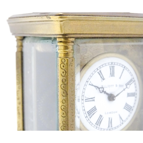 1436 - A small brass carriage clock with white enamel dial with Roman Numerals and signed ' Elliot & Son Lo... 