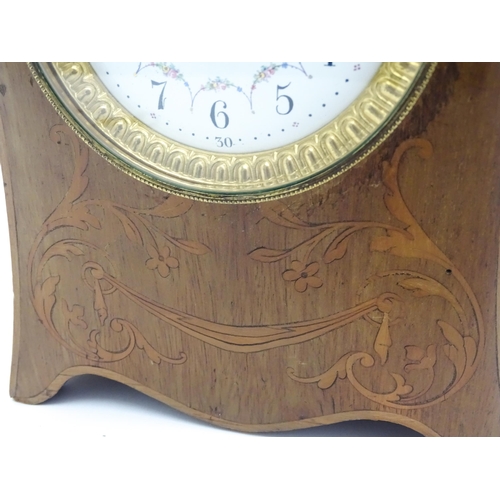 1437 - A late 19thC / early 20thC  mahogany cased French mantle clock with satinwood inlay and white enamel... 