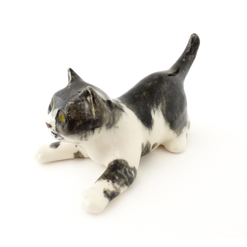 158 - A Winstanley model of a playful black and white kitten / cat, size 3. Marked under. Approx. 9