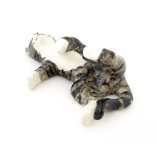 159 - A Winstanley model of a tabby cat rolling over, size 5. Marked under. Approx. 12