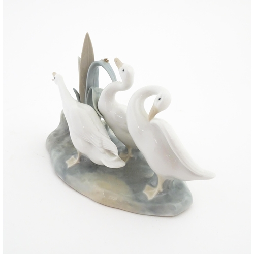 181 - A Lladro model depicting three geese, model no. 4549. Marked under. Approx. 9