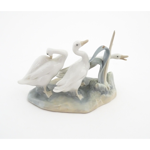 181 - A Lladro model depicting three geese, model no. 4549. Marked under. Approx. 9