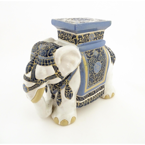 185 - A ceramic jardiniere stand modelled as an elephant. Approx. 16