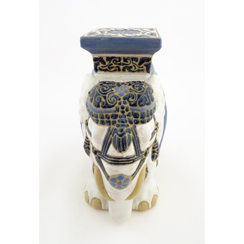 185 - A ceramic jardiniere stand modelled as an elephant. Approx. 16