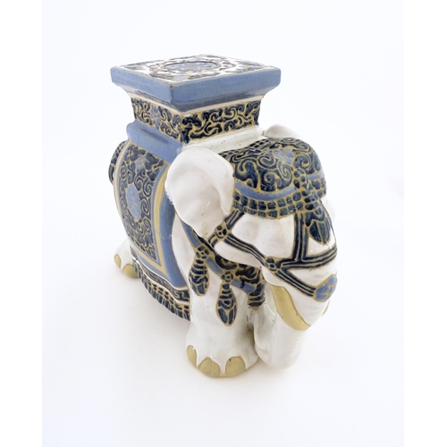 185 - A ceramic jardiniere stand modelled as an elephant. Approx. 16