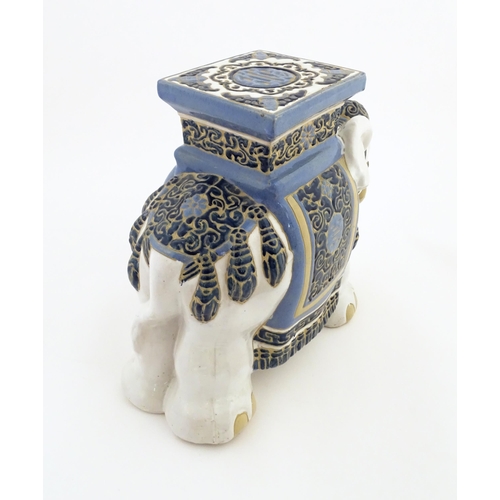 185 - A ceramic jardiniere stand modelled as an elephant. Approx. 16