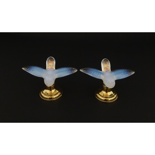 211 - A pair of glass models of swallows raised on French silver gilt stands, stamped Odiot. Approx. 2 1/4... 