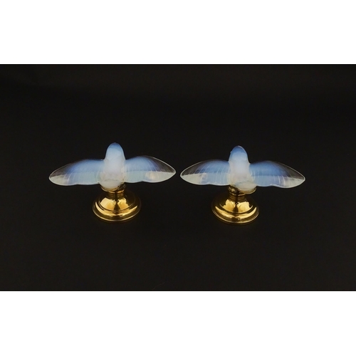 211 - A pair of glass models of swallows raised on French silver gilt stands, stamped Odiot. Approx. 2 1/4... 