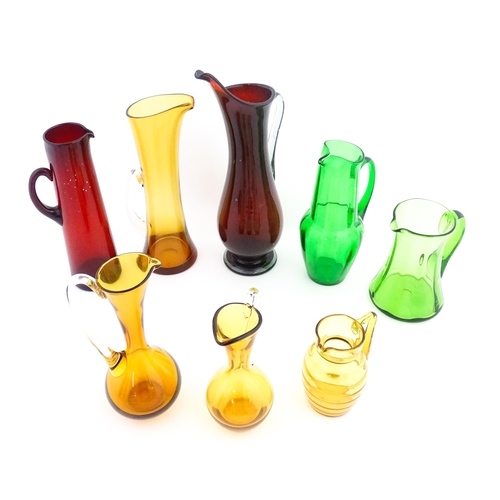 262A - Eight assorted mid century glass jugs / pitchers, to include lemonade jugs, water jugs and a Whitefr... 