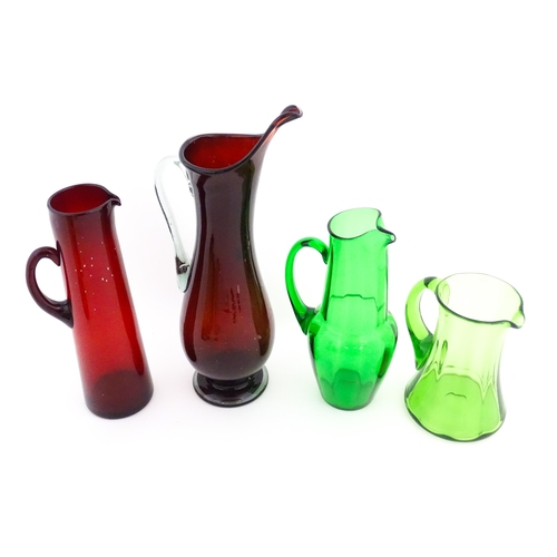 262A - Eight assorted mid century glass jugs / pitchers, to include lemonade jugs, water jugs and a Whitefr... 