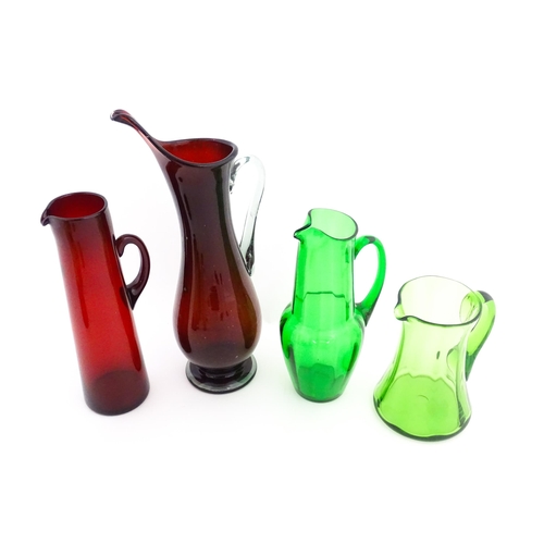 262A - Eight assorted mid century glass jugs / pitchers, to include lemonade jugs, water jugs and a Whitefr... 