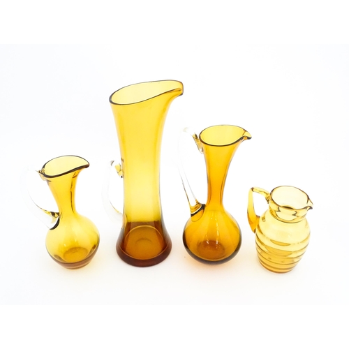 262A - Eight assorted mid century glass jugs / pitchers, to include lemonade jugs, water jugs and a Whitefr... 