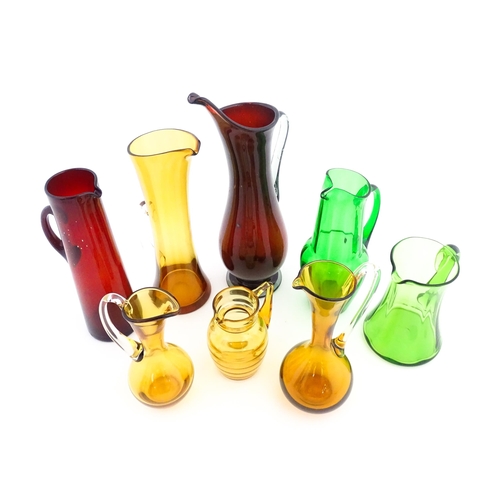 262A - Eight assorted mid century glass jugs / pitchers, to include lemonade jugs, water jugs and a Whitefr... 