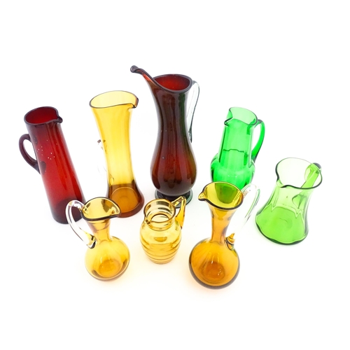 262A - Eight assorted mid century glass jugs / pitchers, to include lemonade jugs, water jugs and a Whitefr... 