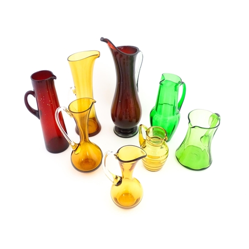 262A - Eight assorted mid century glass jugs / pitchers, to include lemonade jugs, water jugs and a Whitefr... 