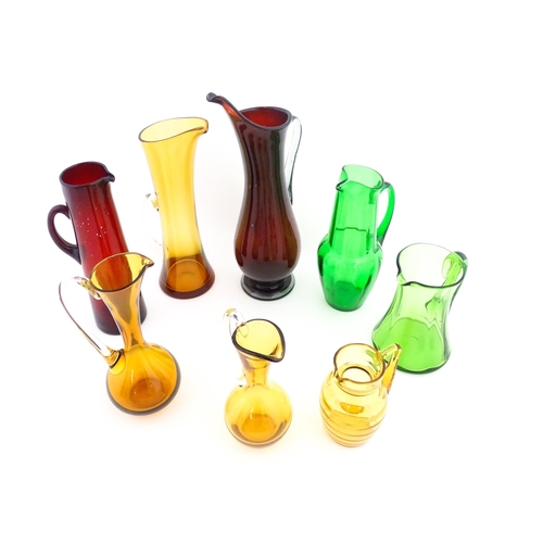 262A - Eight assorted mid century glass jugs / pitchers, to include lemonade jugs, water jugs and a Whitefr... 