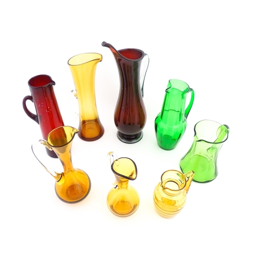 262A - Eight assorted mid century glass jugs / pitchers, to include lemonade jugs, water jugs and a Whitefr... 