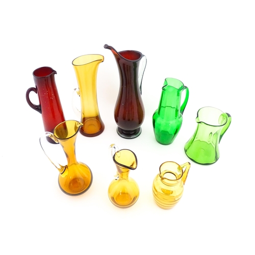 262A - Eight assorted mid century glass jugs / pitchers, to include lemonade jugs, water jugs and a Whitefr... 