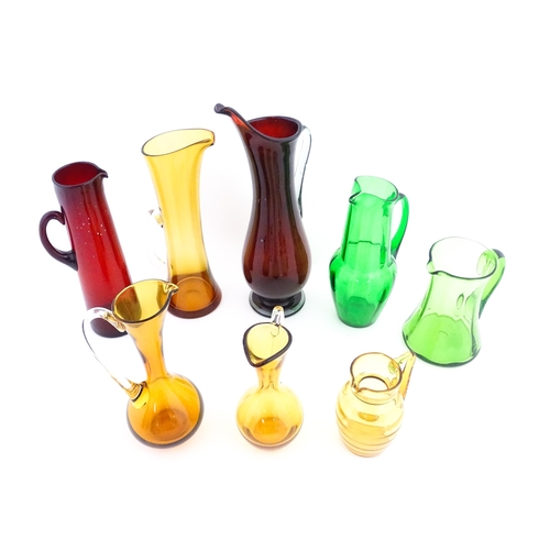 262A - Eight assorted mid century glass jugs / pitchers, to include lemonade jugs, water jugs and a Whitefr... 