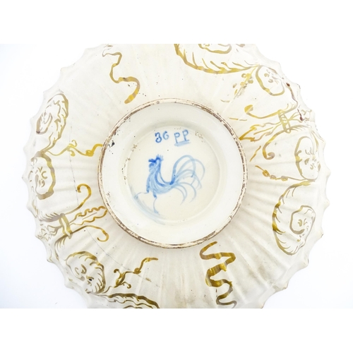 69 - An Italian Cantagalli lustre charger decorated with scrolling floral and foliate detail in blue and ... 