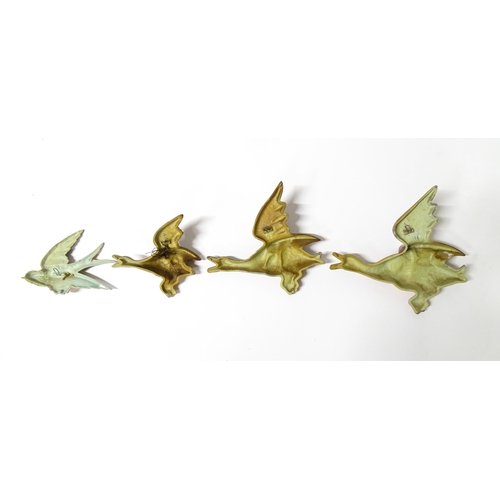 1083 - Three 20thC Parkside cast graduated wall plaques modelled as ducks in flight. Together with a cast s... 