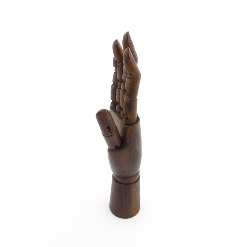 1101 - A 20thC artist's wooden lay hand with articulated fingers. Approx. 10 1/4