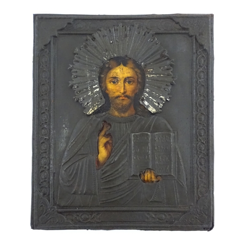 1106 - An early 20thC Russian icon depicting Christ Pantocrator with an embossed silver plate surround. App... 