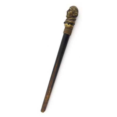 1109 - A 20thC cast cane top modelled as the head of a cardinal / priest mounted on a short stick. Approx. ... 