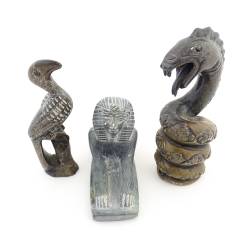 1113 - Three 20thC soapstone carvings to include a coiled snake, a stylised bird and a sphinx. Snake approx... 