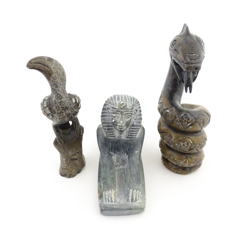 1113 - Three 20thC soapstone carvings to include a coiled snake, a stylised bird and a sphinx. Snake approx... 