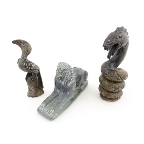 1113 - Three 20thC soapstone carvings to include a coiled snake, a stylised bird and a sphinx. Snake approx... 