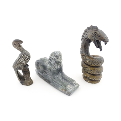 1113 - Three 20thC soapstone carvings to include a coiled snake, a stylised bird and a sphinx. Snake approx... 