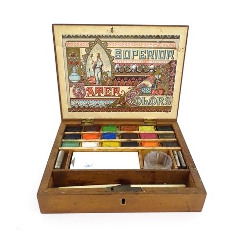 1116 - A late 19th / early 20thC artist's wooden paint box with paper label to interior lid for Superior Wa... 