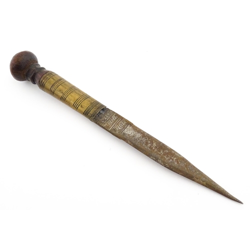 1128 - Ethnographic / Native / Tribal : An African dagger / knife with a wooden handle, the blade with engr... 