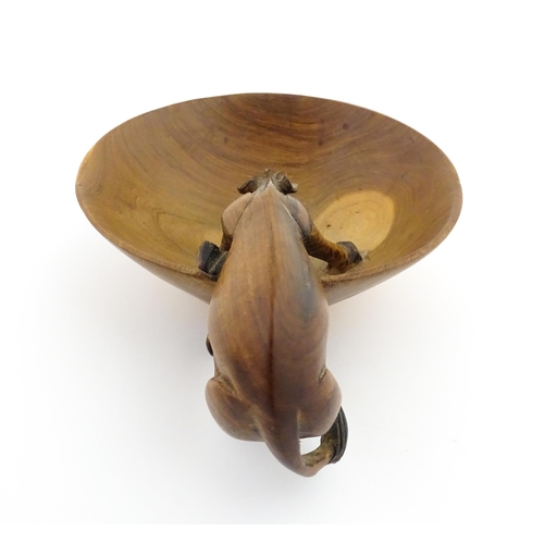 1129 - Ethnographic / Native / Tribal : An African wooden bowl with carved drinking giraffe detail. Numbere... 