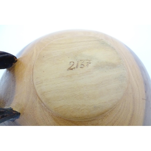 1129 - Ethnographic / Native / Tribal : An African wooden bowl with carved drinking giraffe detail. Numbere... 