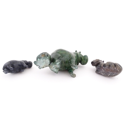 1133 - A carved hippo / hippopotamus and calf. Together with two carved soapstone hippos. Largest approx. 8... 