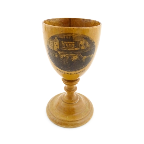 1146 - A 19thC Mauchline ware egg cup with a vignette depicting Stirling Castle. Approx. 3 1/4